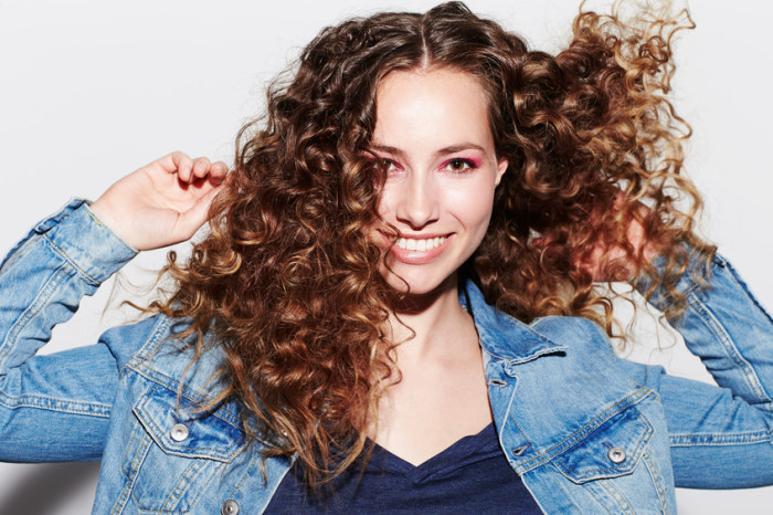 seo hairstyles curly brown hair jean jacket
