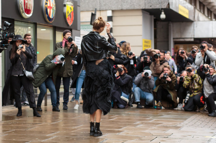 Elena Perminova surrounded by photographers during London Fashion Week