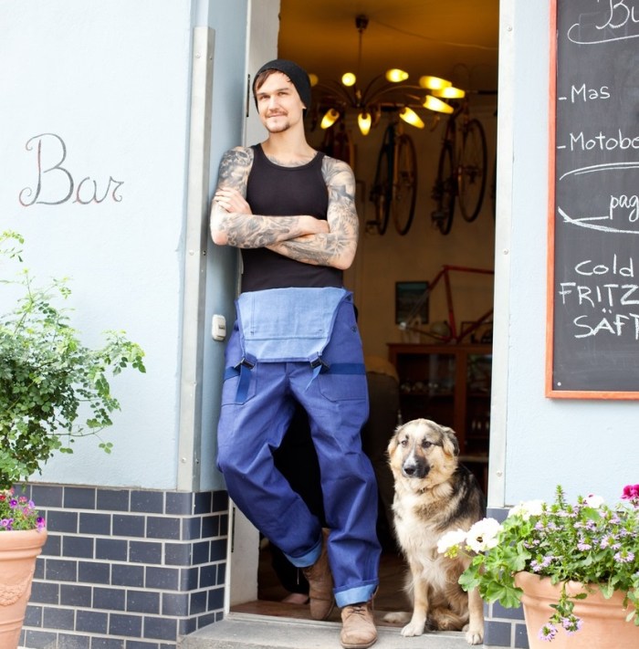 Bicycle shop owner or mechanic with dog