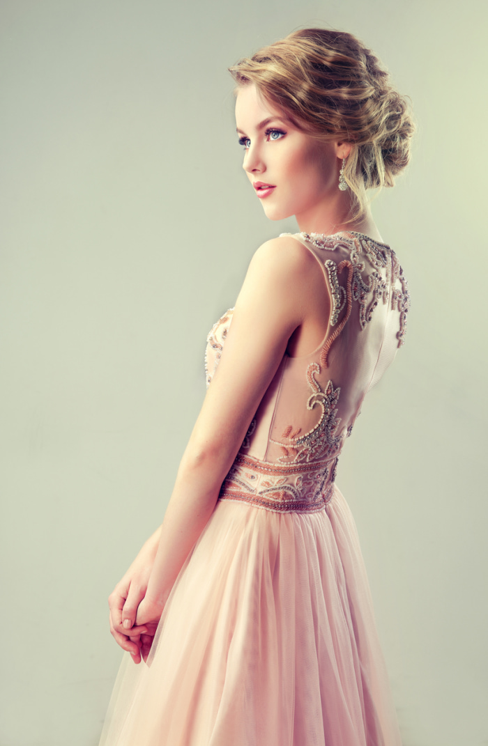 Beautiful girl light brown hair with an elegant hairstyle.