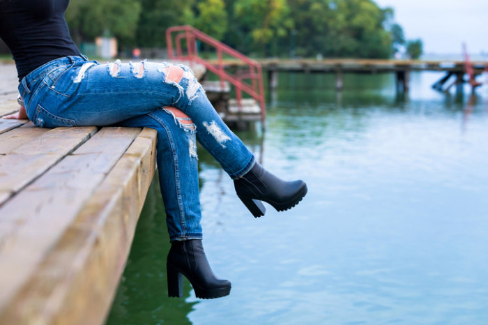 girl legs on pier